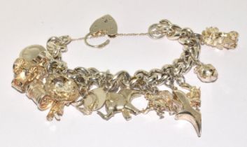 Silver heavy hallmarked charm bracelet with locket clasp