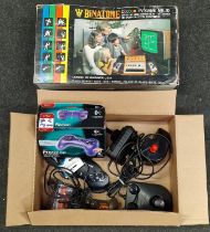 A vintage boxed Binatone TV game together with a box of gaming controllers etc.