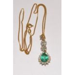 An 18ct gold emerald and diamond pendant on 18ct gold chain. (boxed)