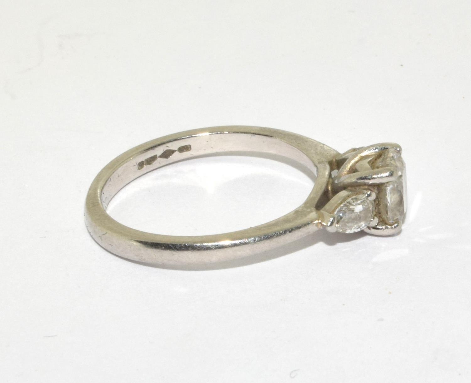 A Diamond solitaire with two side stones approx 0.80points set in a platinum ring, Boxed (Size M) - Bild 4 aus 5