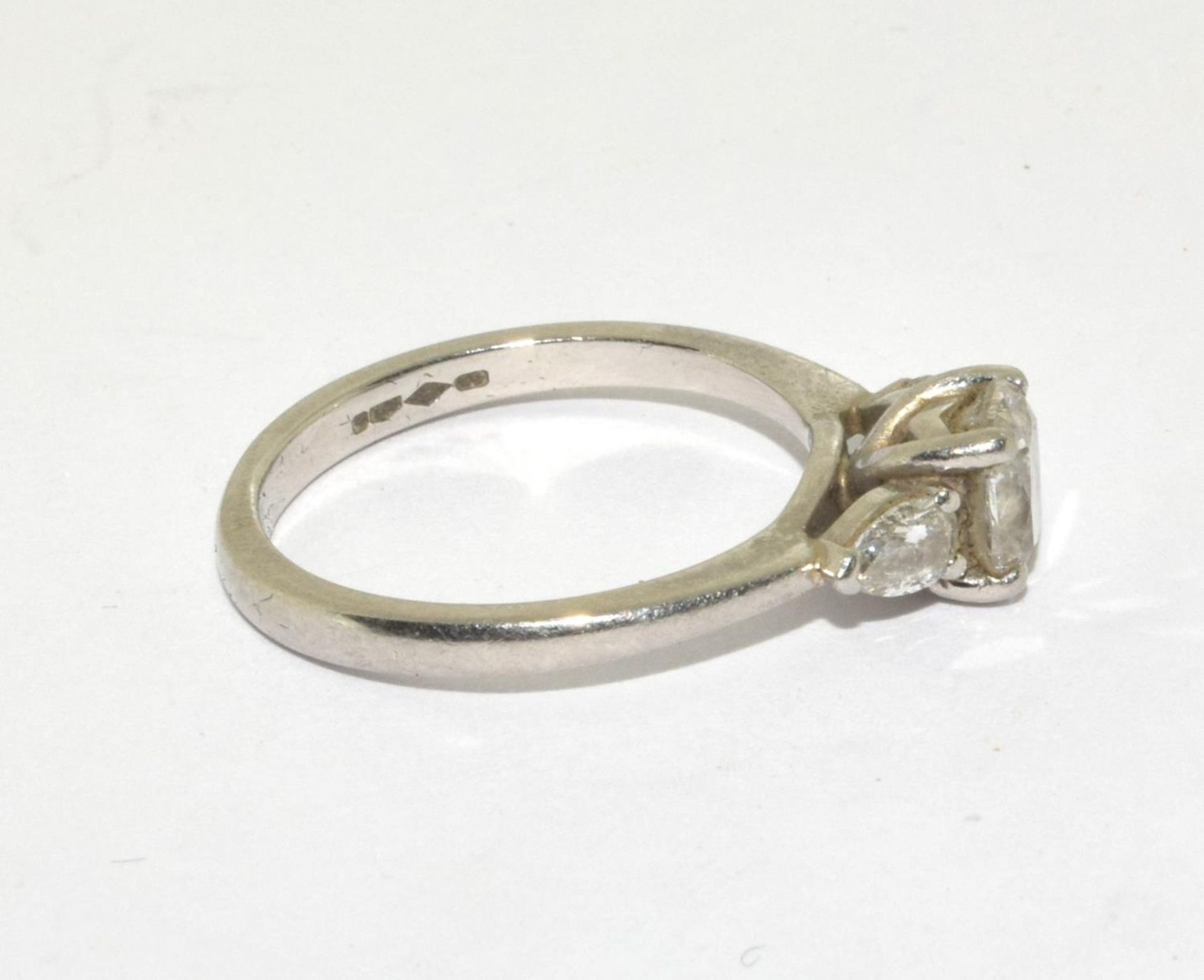 A Diamond solitaire with two side stones approx 0.80points set in a platinum ring, Boxed (Size M) - Image 4 of 5