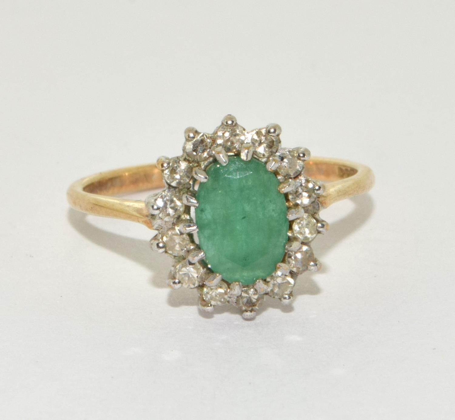 A 9ct gold emerald and diamond ring Size L +