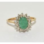 A 9ct gold emerald and diamond ring Size L +