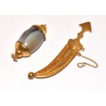 Yellow metal Arabian Knife in a scabbard together an agate yellow metal capped charm