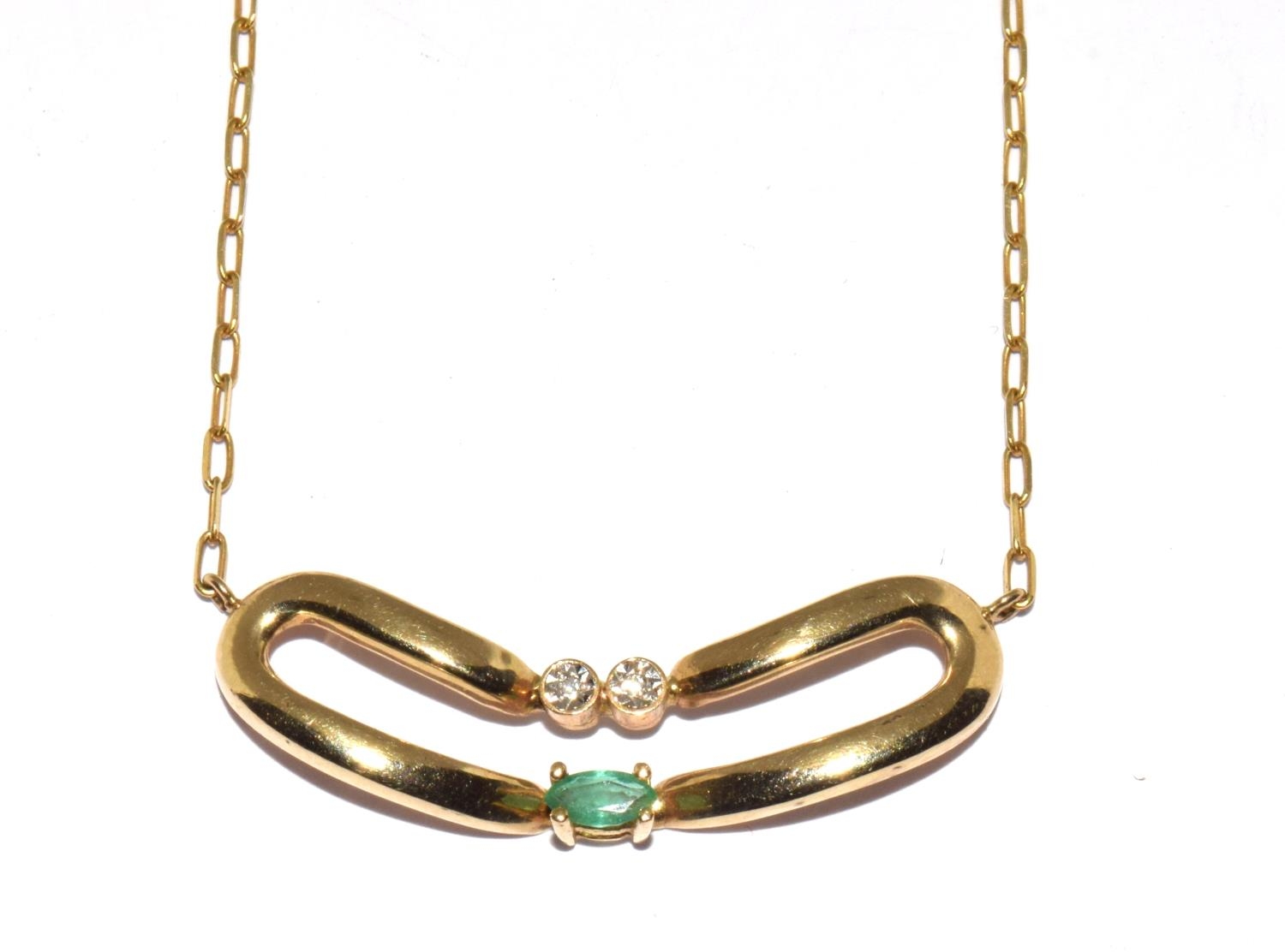 9ct gold diamond and Emerald wish bone pendant on a 14ct gold chain