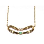 9ct gold diamond and Emerald wish bone pendant on a 14ct gold chain
