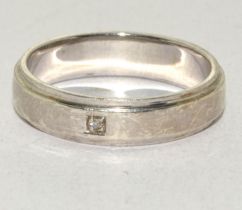 A 925 silver wedding band set with small stone, Size P