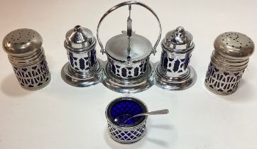 2 x Mixed silver plate condiment sets with blue glass liners