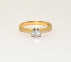 An 18ct gold diamond solitaire ring Approx 0.40points, 3.6g and size M