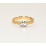 An 18ct gold diamond solitaire ring Approx 0.40points, 3.6g and size M