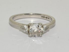A Diamond solitaire with two side stones approx 0.80points set in a platinum ring, Boxed (Size M)