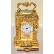 Rococo style Miniature carriage clock and key working at time of cataloguing