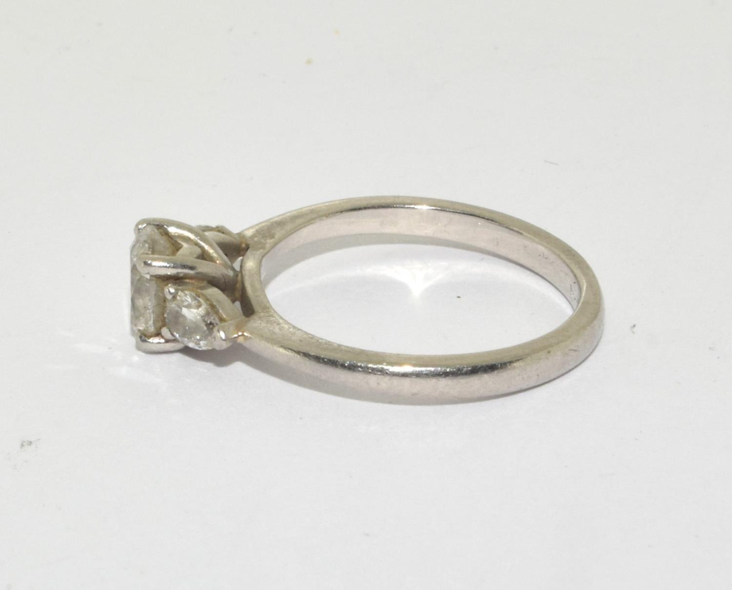 A Diamond solitaire with two side stones approx 0.80points set in a platinum ring, Boxed (Size M) - Image 2 of 5