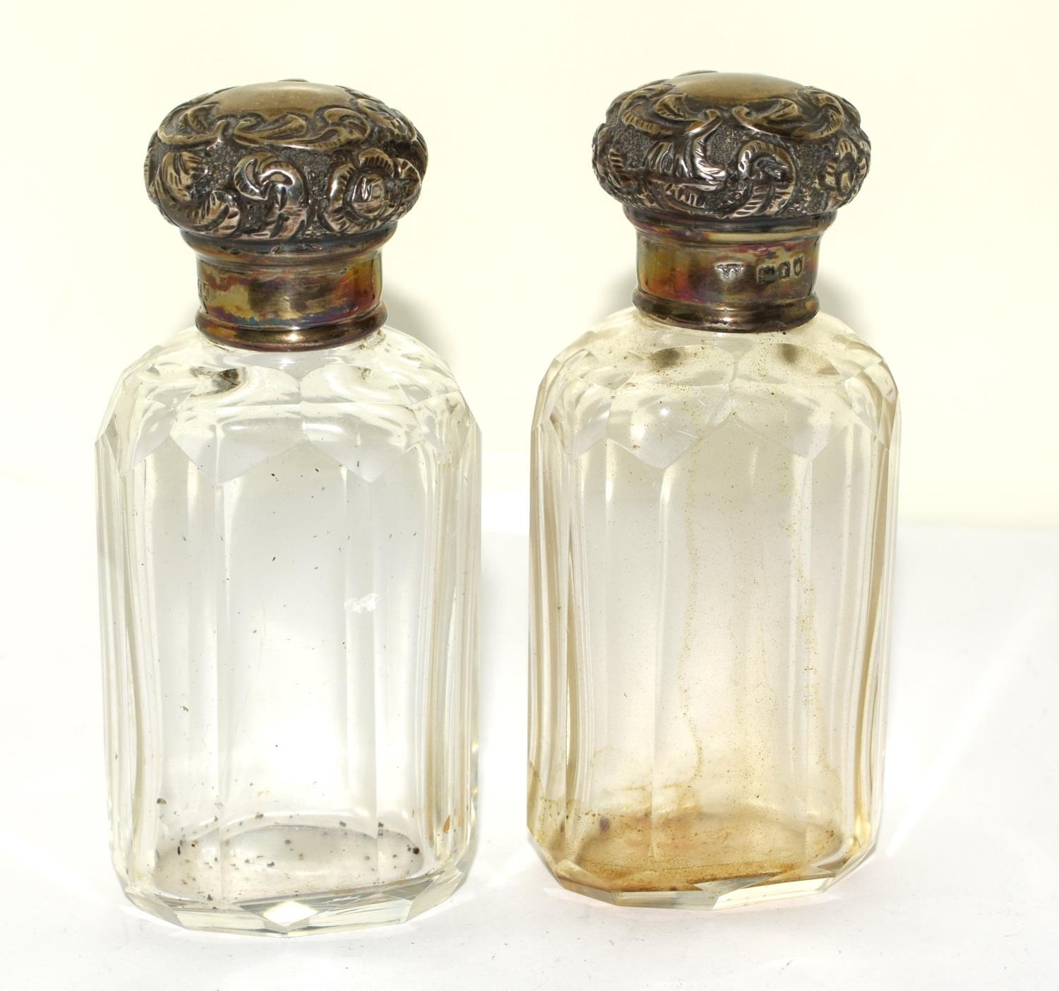 Pair silver H/M dressing table bottles