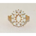 9ct gold ladies Opal and Diamond cluster ring in a good open work mount size N