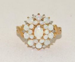 9ct gold ladies Opal and Diamond cluster ring in a good open work mount size N