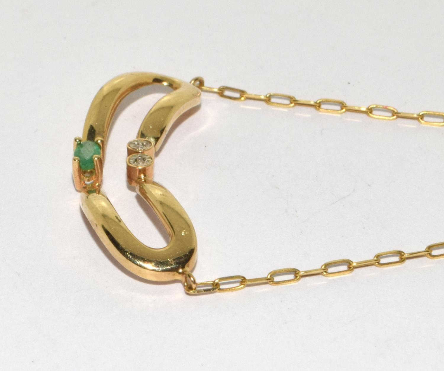 9ct gold diamond and Emerald wish bone pendant on a 14ct gold chain - Image 3 of 6