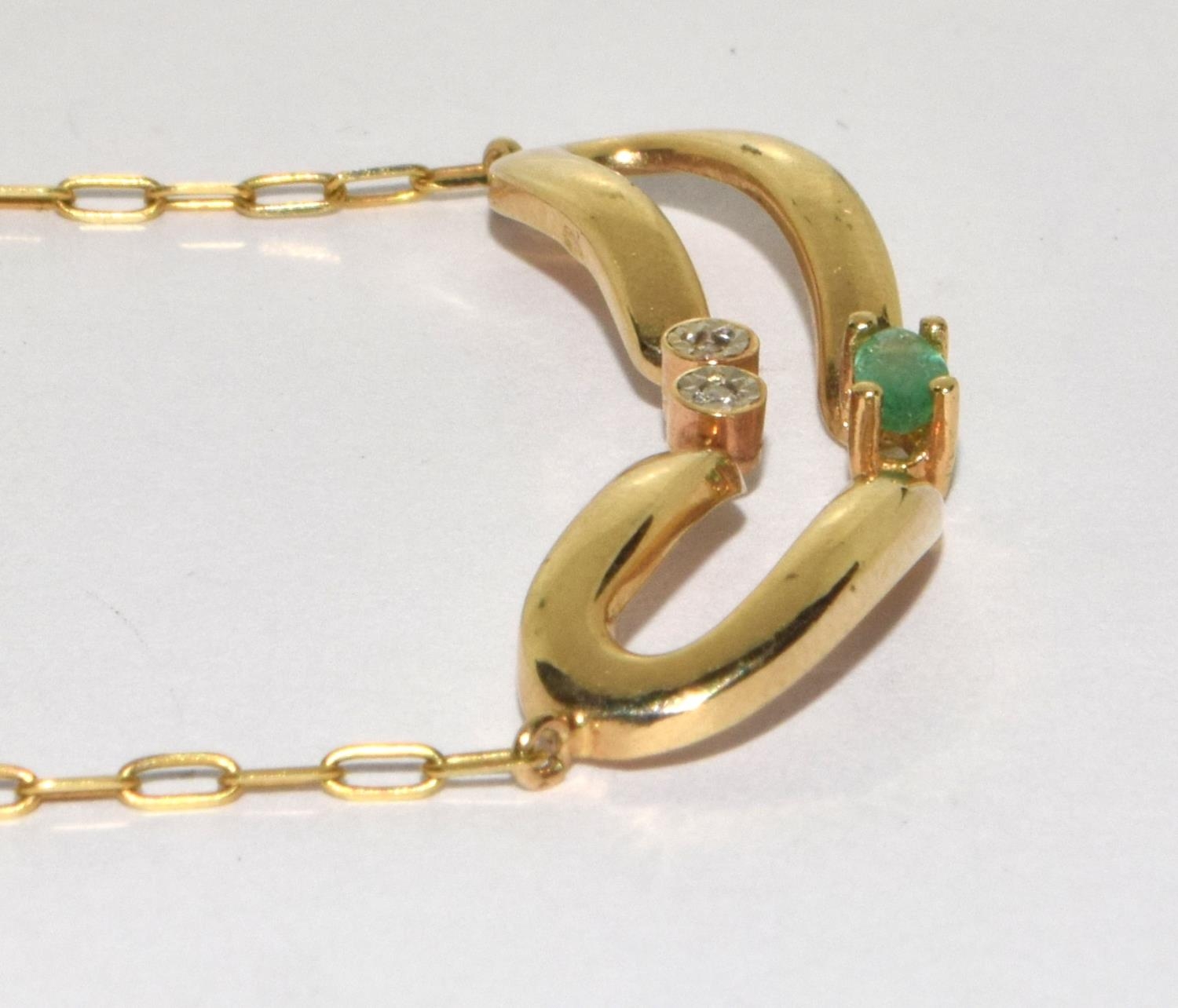9ct gold diamond and Emerald wish bone pendant on a 14ct gold chain - Image 2 of 6