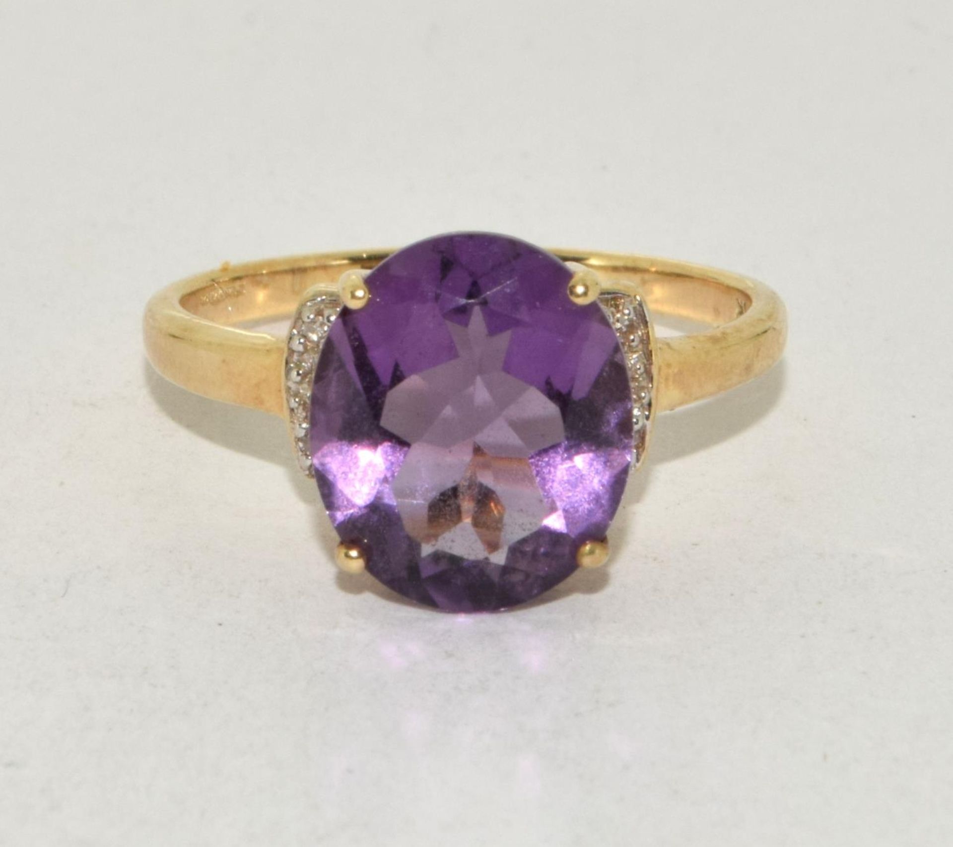 9ct gold ladies Amethyst and Diamond chip shoulder open work ring size R