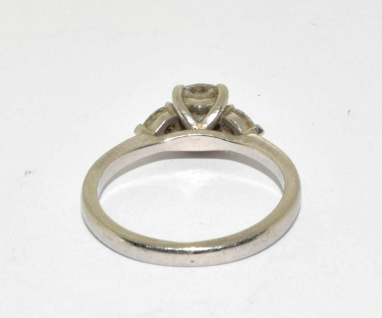 A Diamond solitaire with two side stones approx 0.80points set in a platinum ring, Boxed (Size M) - Bild 3 aus 5