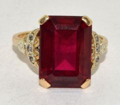 9ct gold ladies Large Ruby square set ring with diamonds to the shank set in an open work setting