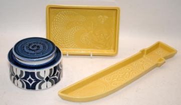 Poole Pottery Robert Jefferson pale yellow plaque together with a dagger, and a Bokhara lidded
