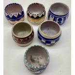 Poole Pottery group of egg cups to include VL, DX, HW, LD, QO, XX pattern.