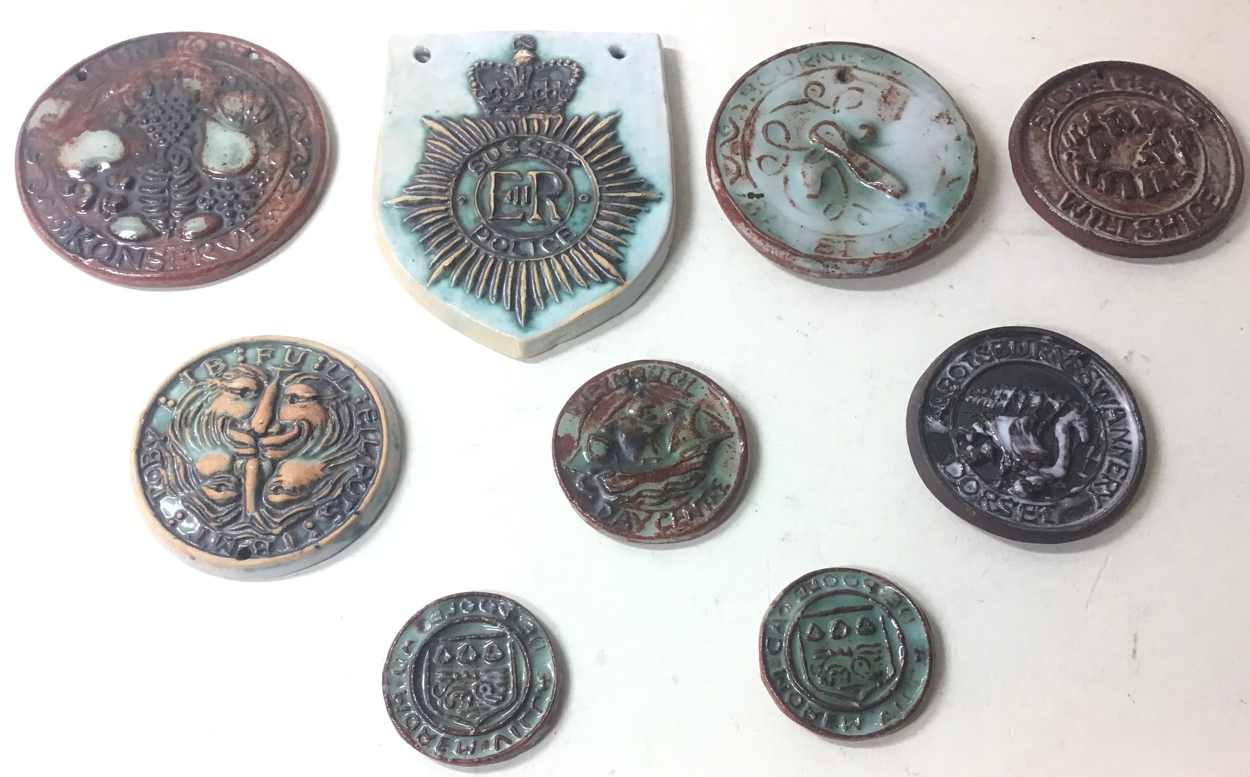 Poole Pottery interest Guy Sydenham small plaques to include Surrey Police crest, Abbotsbury - Image 2 of 4