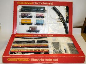 Two vintage Hornby OO gauge Electric Train Sets. Some ancillary items missing from both sets but