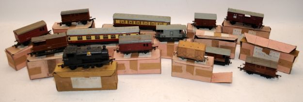A collection of vintage OO gauge rolling stock c/w a steam tank. Includes tin plate examples
