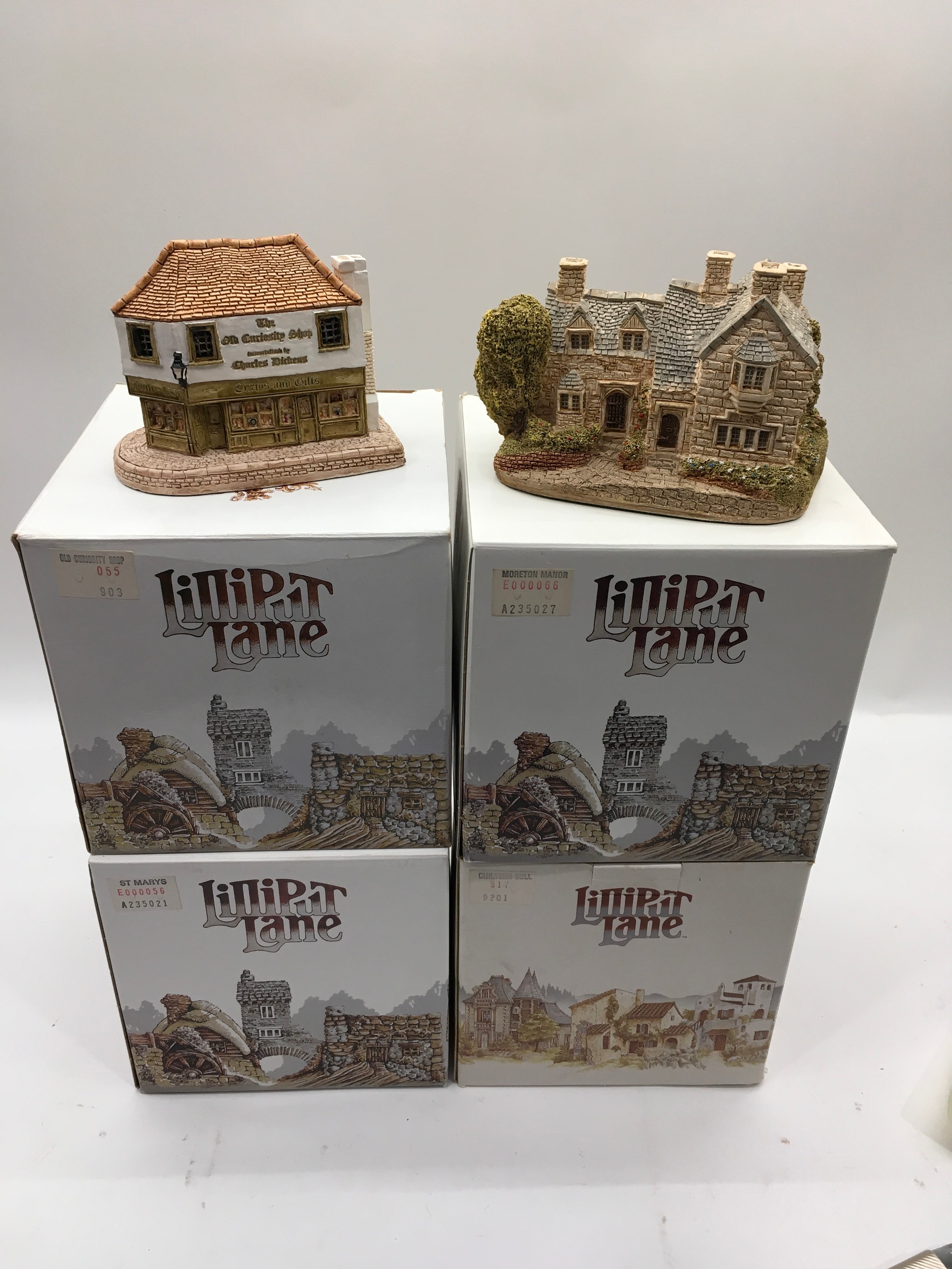 Four Lilliput Lane cottages to incl. Chiltern Hall 517, St Marys 56, Old curiosity shop 055 and