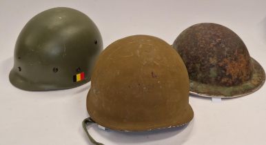 Three military style helmets