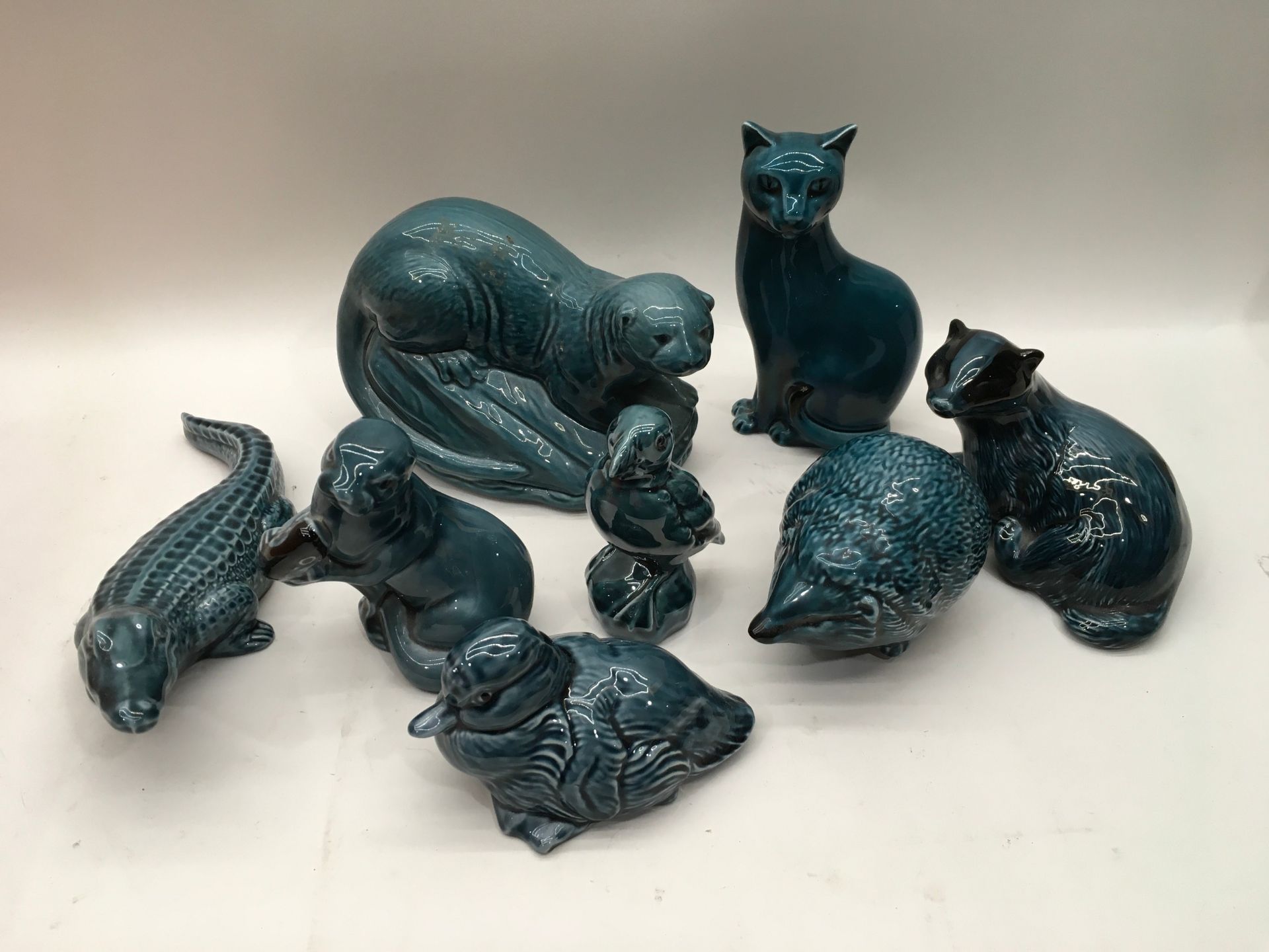 8 blue glazed Poole pottery animals.