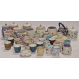 Poole Pottery collection of traditional pattern preserve pots together with a collection of egg