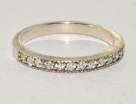 A 925 silver and CZ half eternity band. Size Q