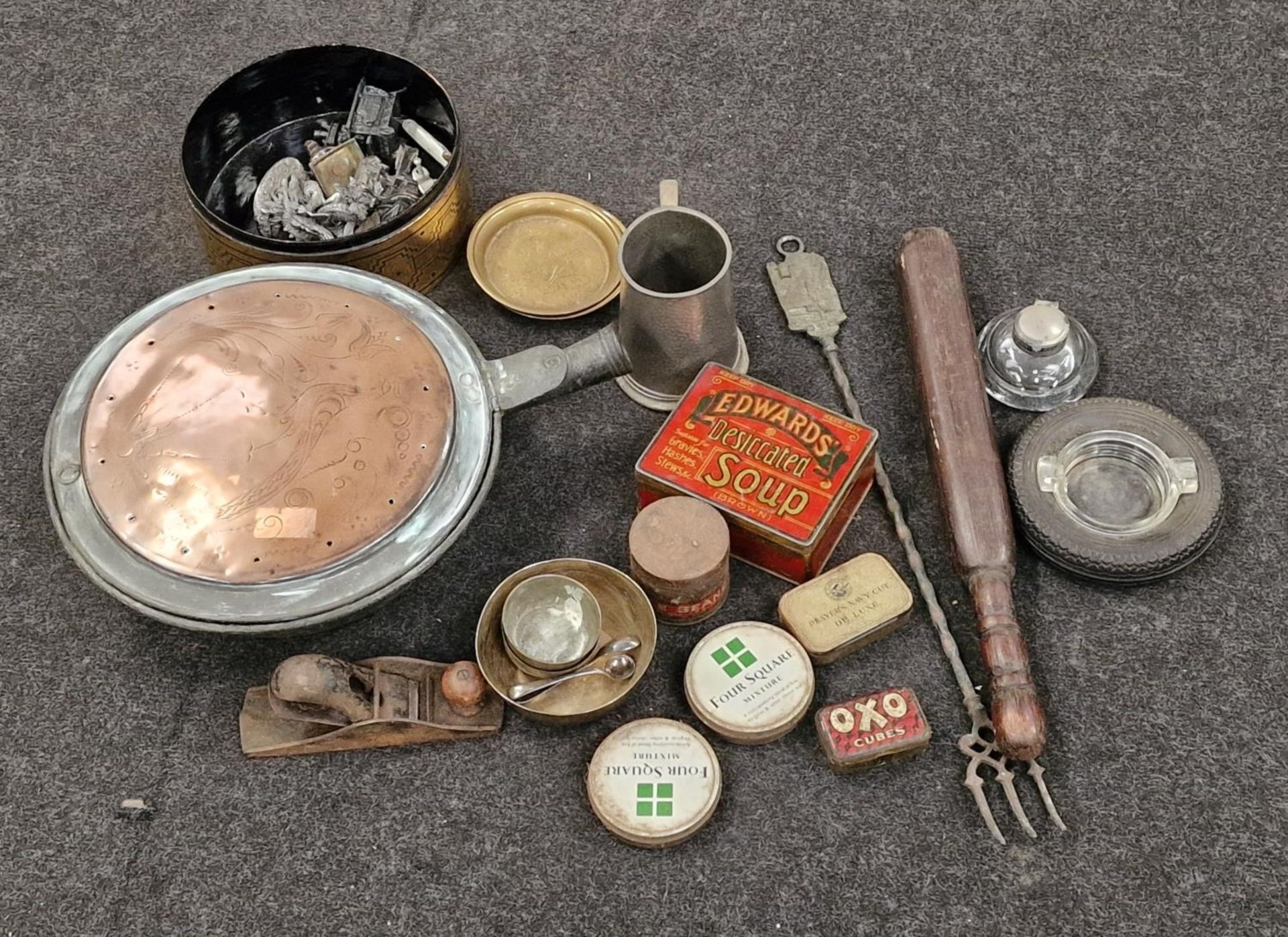 Collection of metalware items and other curios.