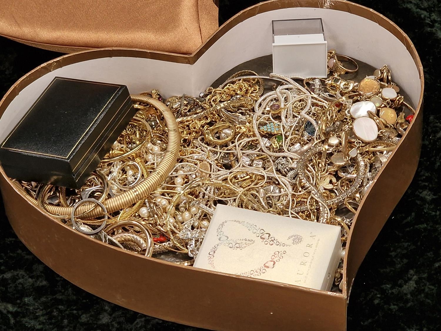 A box of costume jewellery to include gold and silver.