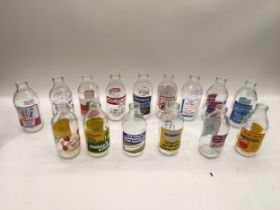 15 glass advertising bottles.