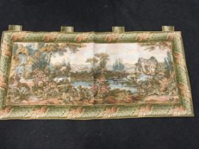 Vintage tapestry wall hanging depicting an outdoor scene.