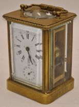 Brass cased striking carriage clock with key needs a service running when catalogued