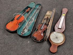 Two violins both with cases together with a vintage wall barometer.