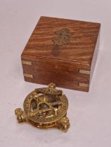 Contemporary brass nautical compass in wooden case.