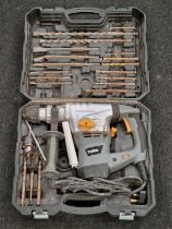 Titan electric corded hammer drill with case and attachments.