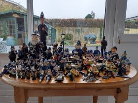 Huge collection of various police figurines to include people and animals. Good lot to sort through.