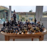 Huge collection of various police figurines to include people and animals. Good lot to sort through.