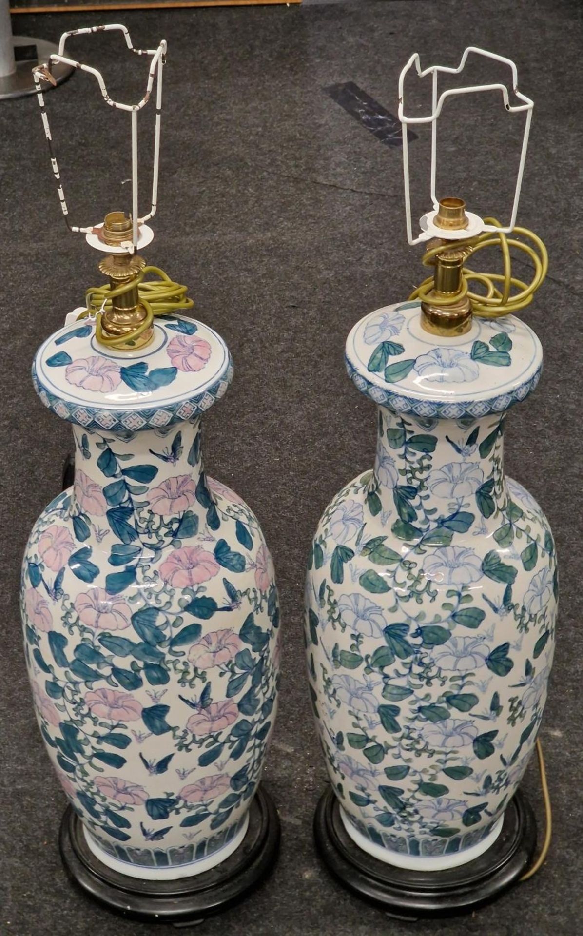 Pair of large Oriental bulbous shape patterned lamps on wooden bases. Each approx 80cm tall.