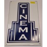 An enamel cinema sign.