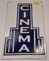 An enamel cinema sign.