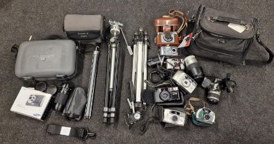 Collection of vintage cameras, camcorders and accessories to include Canon examples.