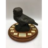 A bronzed owl trophy.